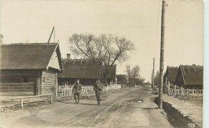 RPPC Postcard; WWI Soldiers Walk Down Village Road, Tuchoměřice Czech Republic