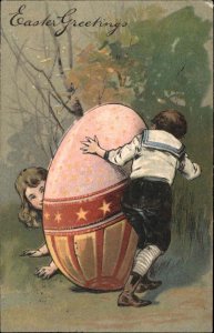 Easter Children Play Hide & Seek Giant Egg Embossed c1900s-10s Postcard