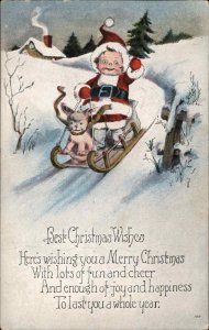 Christmas Little Boy Dressed as Santa Claus with Dog Reindeer Vintage Postcard