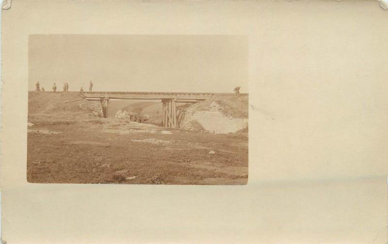 WORLD WAR ONE Real photo postcard military men soldiers railroad viaduct