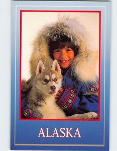 Postcard Alaskan native girl with husky puppy, Alaska