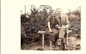 c1920 RPPC Young Couple Seated Garden Bench European Real Photo Postcard