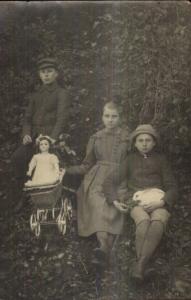 Children Boys & Girl Rabbit & Doll in Carriage c1910 Real Photo Postcard