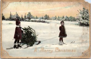 Postcard: A Merry Christmas - Children on Skis hauling tree on sled