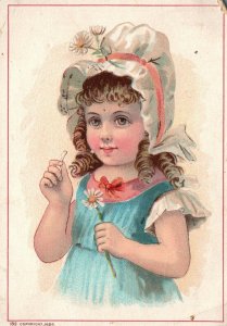 1880s-90s Young Girl Wearing Bonnet with Daffodil Curly Hair Trade Card