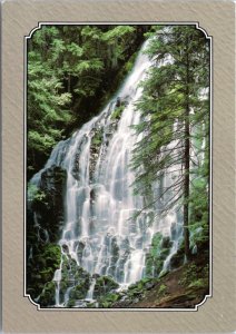 Postcard Scenic Waterfall - Misty Cascade - waterfall over black lava rocks