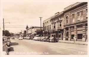 North Vernon Indiana Street Scene Drug Store Liquor Store Real Photo PC JJ658697