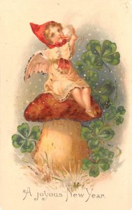 New Years Post Card A Joyous New Year Child on Mushroom with 4-Leaf Clovers W...