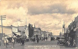 Burns OR Parade of Cowboys on Horseback Signed Heck RPPC Real Photo Postcard