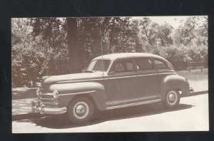 1947 PLYMOUTH 4 DOOR SEDAN VINTAGE CAR DEALER ADVERTISING POSTCARD MOPAR