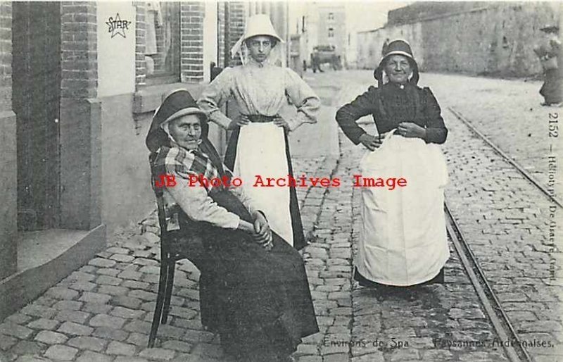 Belgium, Spa, Women in Native Costume on Cobblestone Street, Star