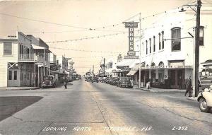 Titusville FL Street View Storefronts Looking North RPPC Postcard