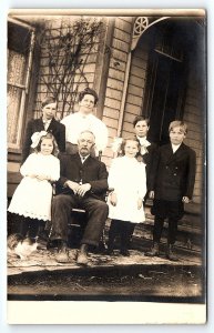 c1910 LARGE FAMILY 3 BOYS 2 GIRLS 1 CAT MOM AND DAD PHOTO RPPC POSTCARD P2346