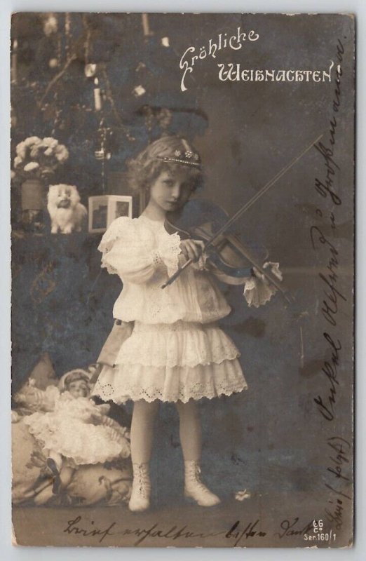 RPPC Girl Playing Violin At Christmas Tree Toys Doll Real Photo Postcard P26