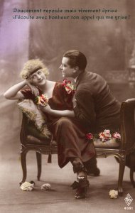 VINTAGE POSTCARD MAN PROPOSING TO WOMAN ON LONG CHAIR FLOWERS c. 1930