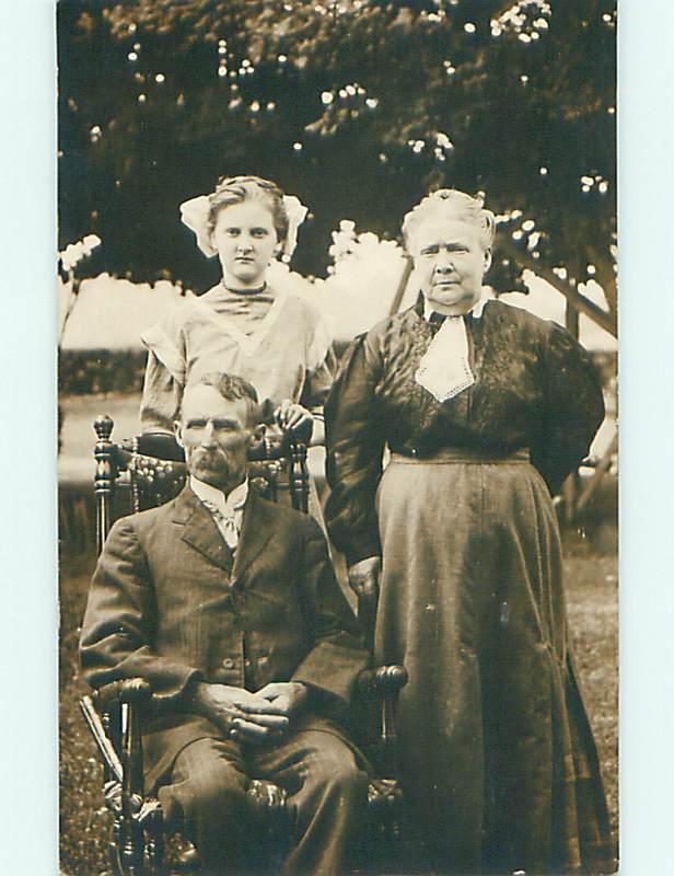 Pre-1918 rppc GIRL WITH BOW IN HAIR WITH HER ELDERS r5818