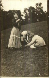 Foraging for Mushrooms? Woman & 2 Men in Field c1910 Real Photo Postcard