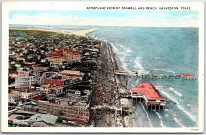 VINTAGE POSTCARD AERIAL VIEW OF THE SEAWALL AND CROWDED BEACH AT GALVESTON TEXAS