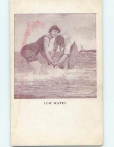 Pre-1907 risque BATHING SUIT GIRL HOLDS HANDS WITH GUY ON SHORELINE HL3692