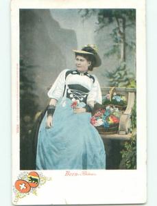 Unused Pre-1907 foreign EUROPEAN WOMAN BESIDE BASKET OF FLOWERS k4089