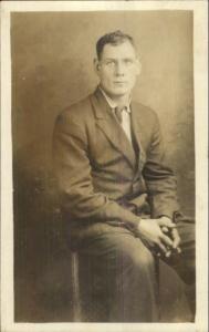 Somber Man Sitting - Elmira NY Electric Studio c1910 Real Photo Postcard