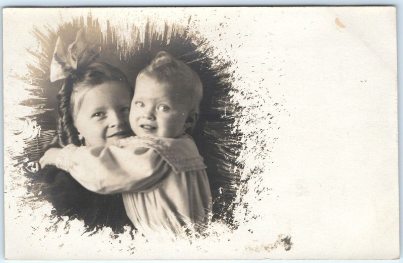 c1900s UDB Cute Little Girl Baby Boy Hug RPPC Negative Border Paint Edited A151