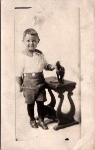 Real Photo Postcard Little Boy with a Toy Horse in a Photo Studio~135976