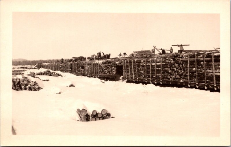 Real Photo Postcard Railroad Train Hauling Logs Through The Snow