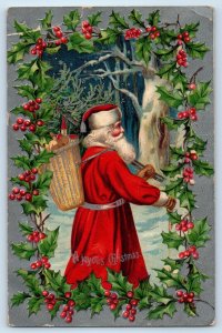 1909 Christmas With Basket Toys Holly Berries Winter Scene Embossed Postcard