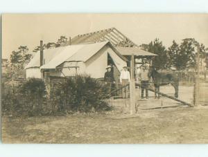 rppc 1910 TENT BESIDE BUILDING UNDER CONSTRUCTION AC8135