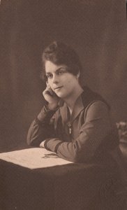 1917 Woman Sitting at Desk Hair Curley Portrait RPPC Postcard