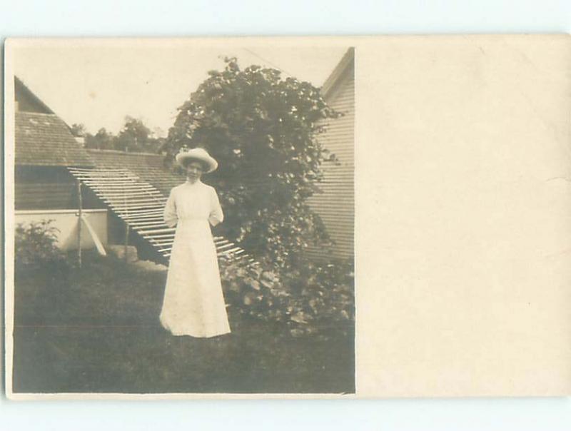 rppc 1920's WOMAN POSING BEHIND THE HOUSE AC8718