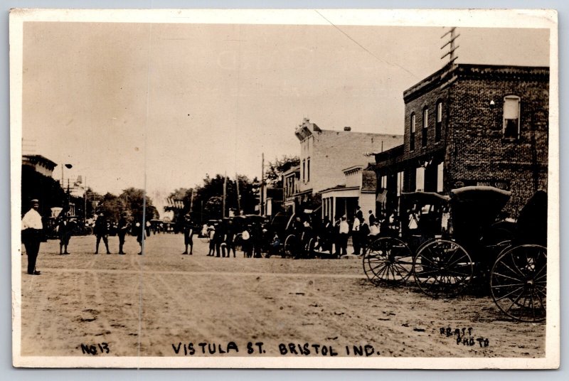 Bristol Indiana~Vistula Street Stores~Horse Buggies~Crowd~Dirt Road~c1915 RPPC