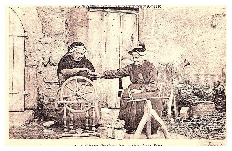 Gramothers spinning cloth on spinning wheel