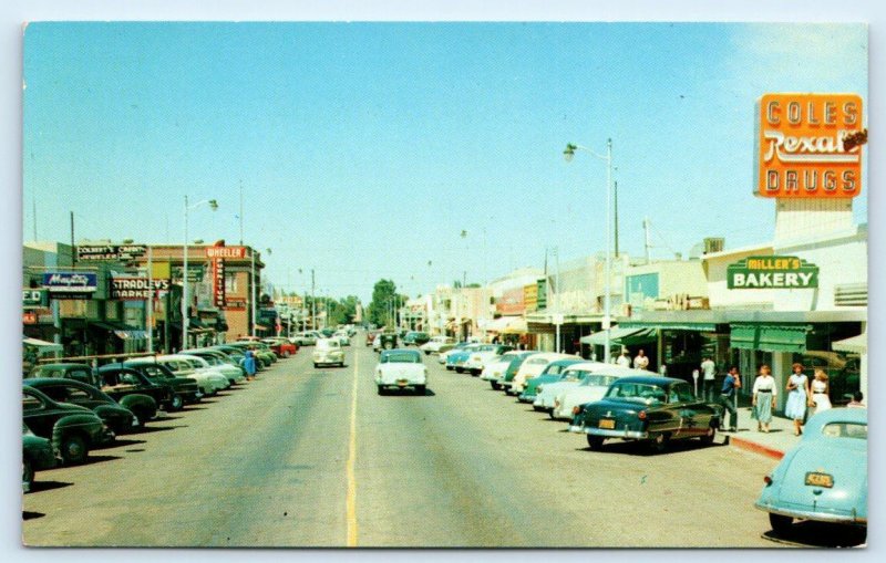 DELANO, CA California ~ MAIN STREET Scene REXALL ~ Bakery c1950s Cars Postcard 