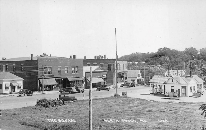 RPPC GAS STATION THE SQUARE NORTH ANSON MAINE REAL PHOTO POSTCARD (c. 1930s)