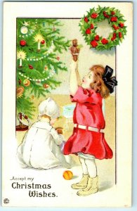 C. 1910 Cute Little Girl Decorating Christmas Tree Postcard P66