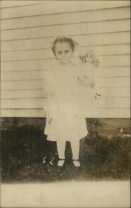 Little Girl Poses w/ Her Doll c1910 Real Photo Postcard - Unused