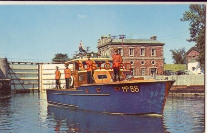 Four ROYAL CANADIAN MOUNTED POLICE on deck of MP 88 Patrol Boat SAULT STE MARIE