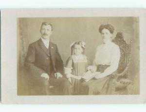 circa 1910 rppc LITTLE GIRL IN PIGTAILS & BOWS WITH HER PARENTS o2626