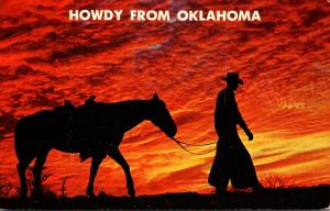 Oklahoma Howdy With Cowboy and Horse At Sunset