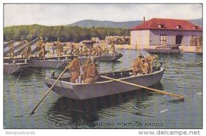 Engineers of the United States Army in row boat building Pontoon Bridge, 00-10s