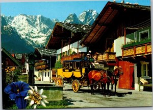 Postcard Germany Garmisch-Partenkirchen Romantic stagecoach on street in spring