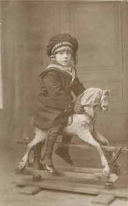 RPPC Little Sailor Boy on Dapple Grey Rocking Horse, HMS Agincourt Cap UK Navy