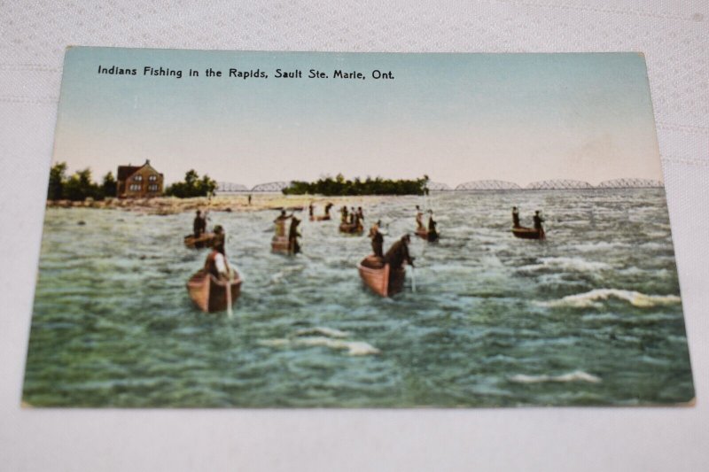 Indians Fishing in the Rapids Sault Ste Marie Ontario Postcard RPPC Canoes