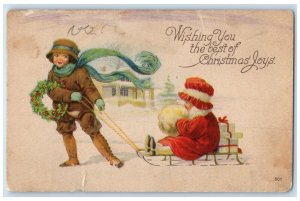 c1910's Christmas Children Sledding Handwarmer Holly Berries Whreat Postcard