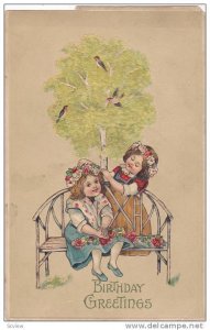 Birthday Greetings, Girls arranging flowers on friend sitting on bench, bird'...