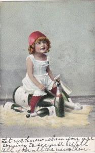 Young Girl Sitting On Champagne Bottle 1907