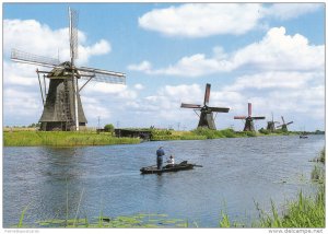 Couple Canoeing in Kinderdijk, Village with 19 Windmills, Holland