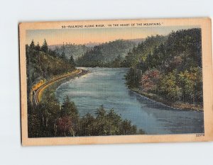 Postcard Railroad Along River In The Heart Of The Mountains